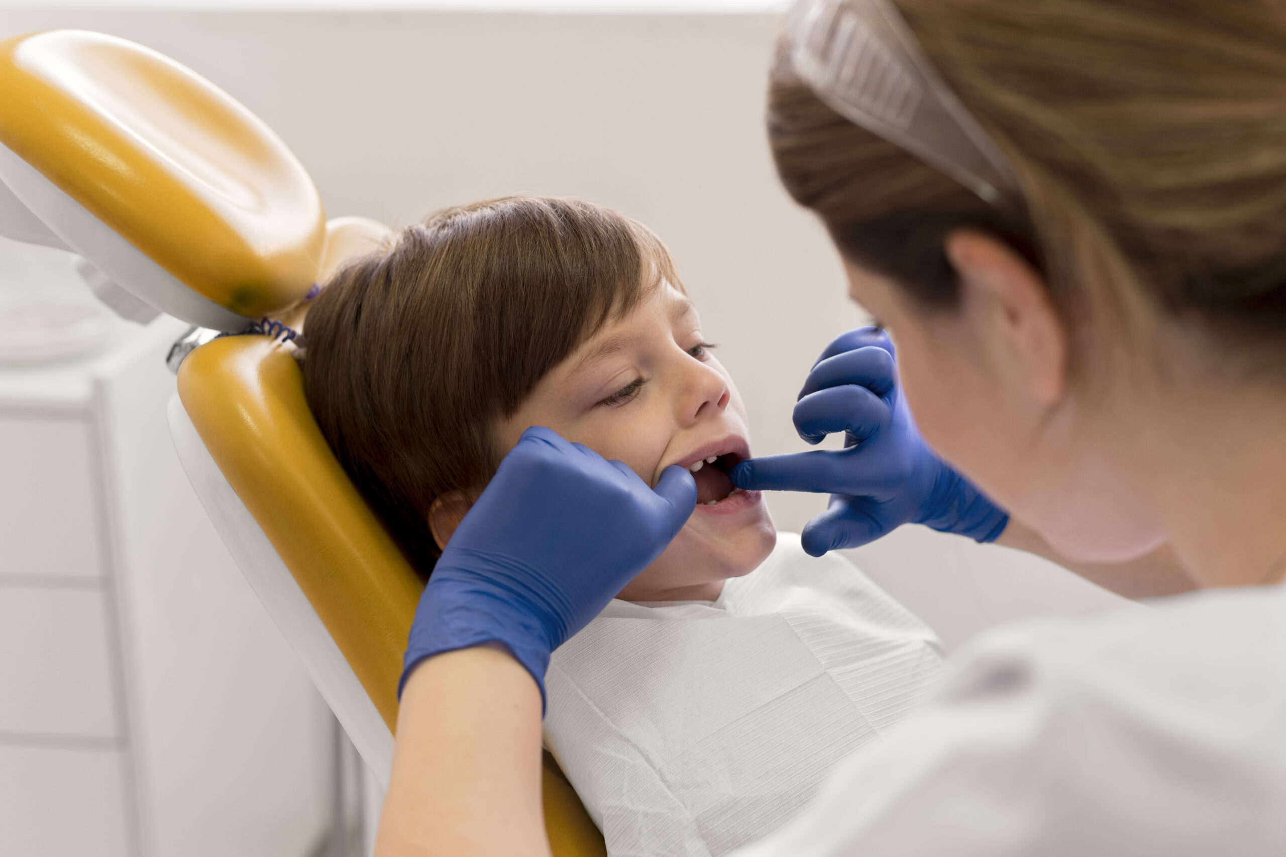 dentist-cleaning-child-s-teeth