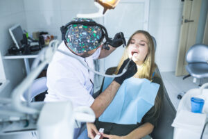dentist-curing-female-patient-s-teeth