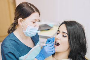 dentist-curing-teeth-patient-clinic
