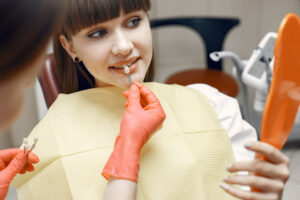 Young woman at the dentist’s reception