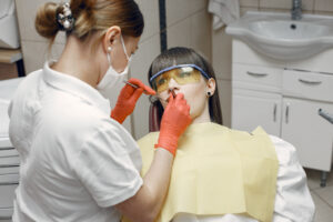 Young woman at the dentist’s reception