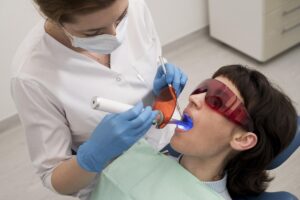 young-female-patient-having-dental-procedure-orthodontist
